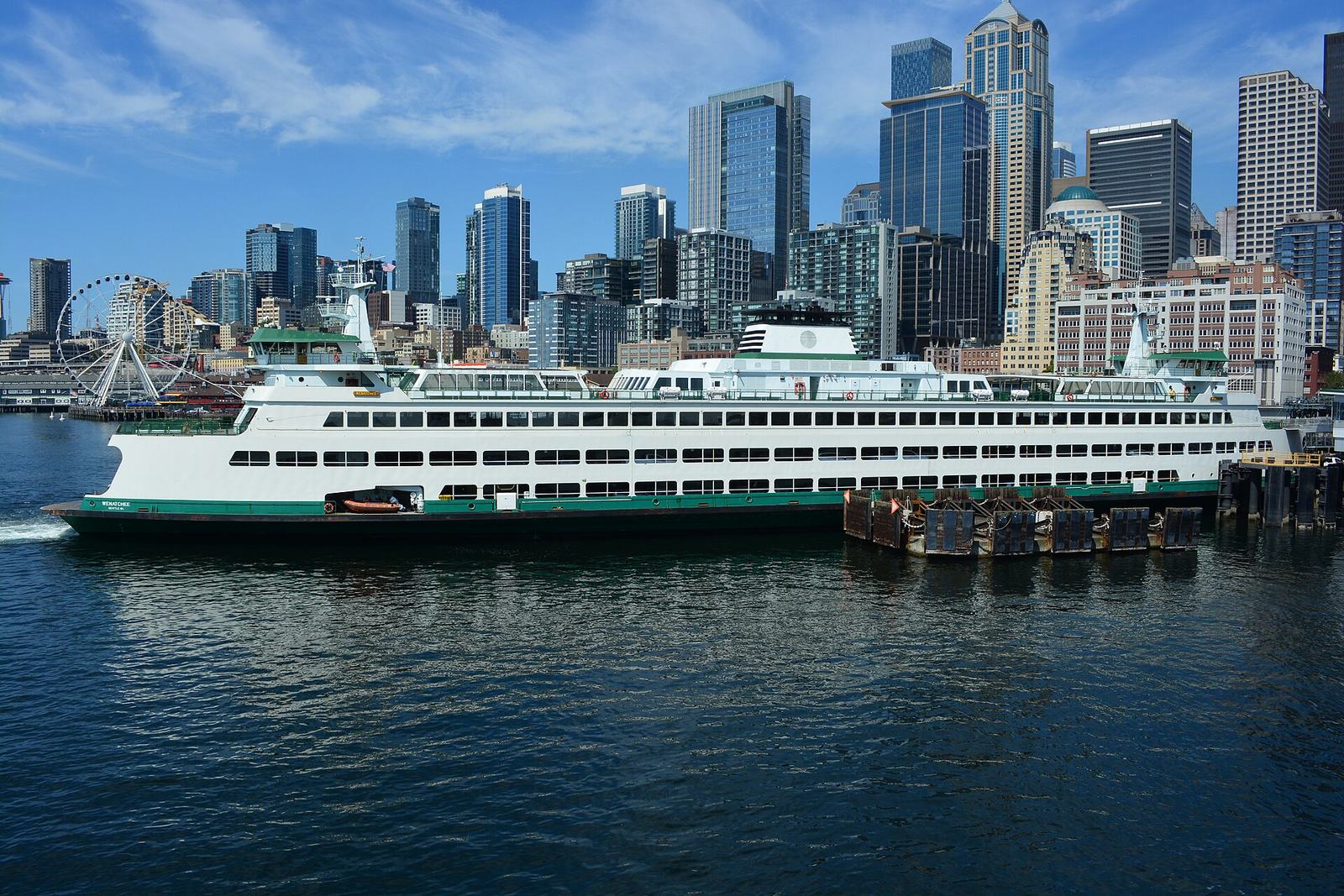 The ferry Wenatchee at Colman Dock with the downtown skyline and the Great Wheel behind