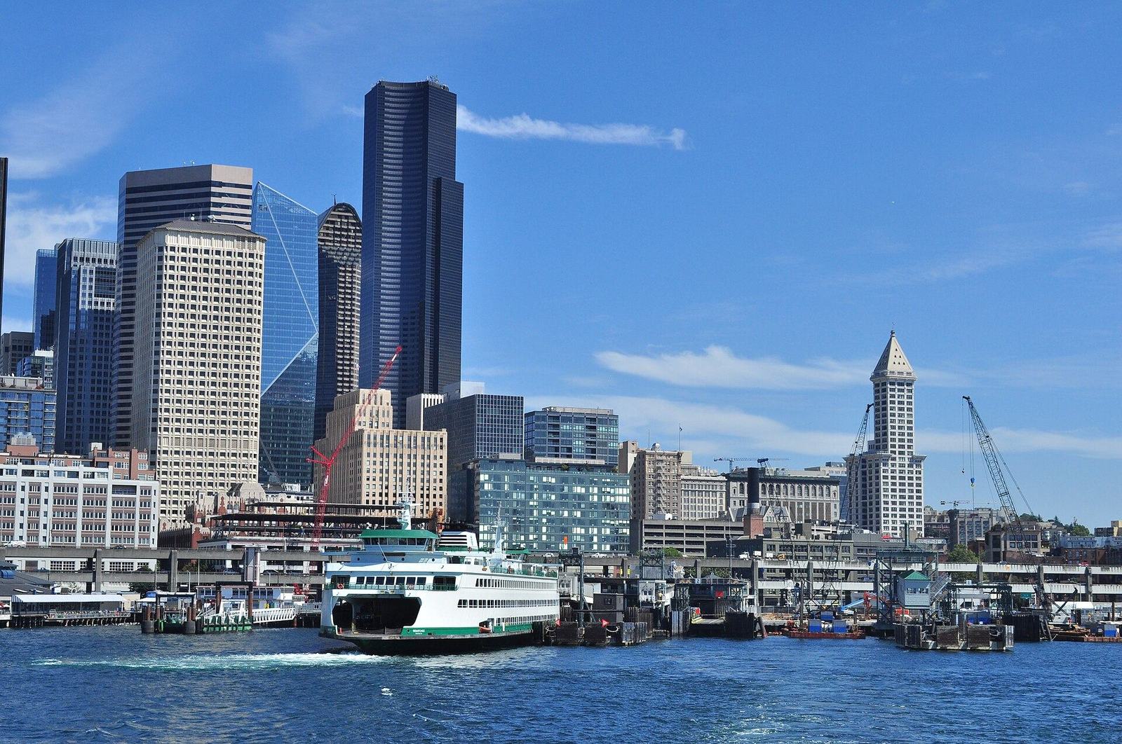The downtown Seattle skyline from Elliott Bay with a ferry at the dock