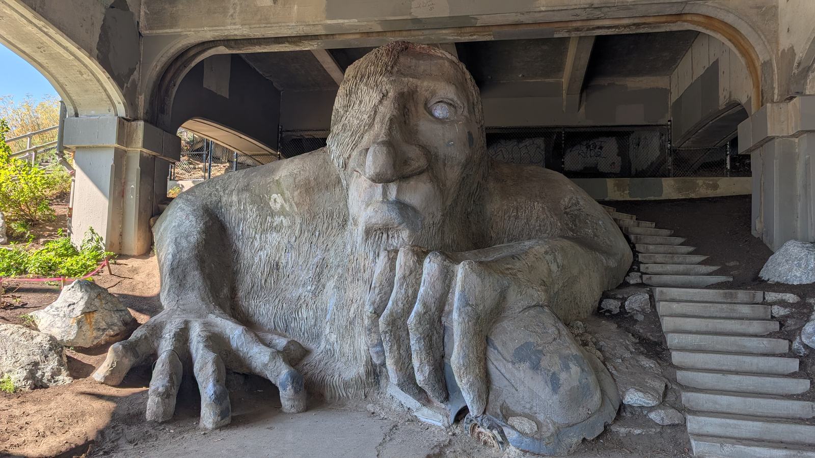 The Fremont Troll under the Aurora Bridge, clutching a Volkswagen